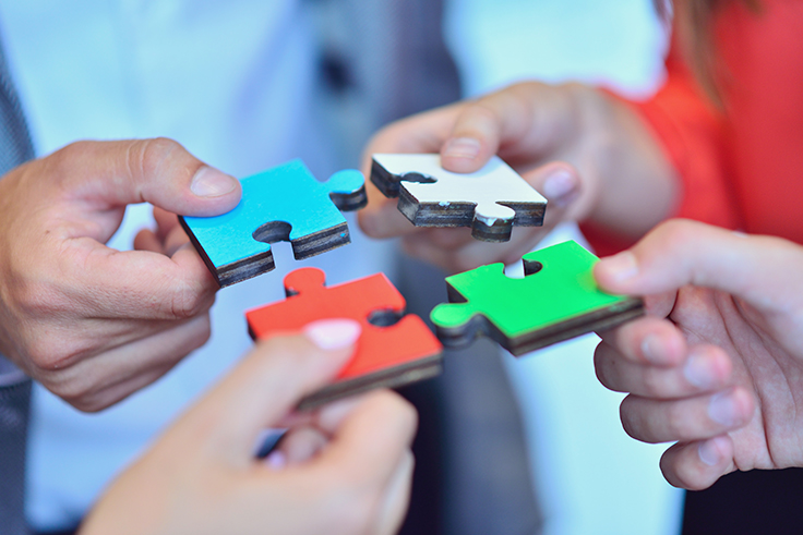 	Business people jigsaw puzzle collaboration team concept