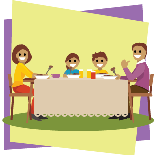 A family of four sitting together at a dining room table.